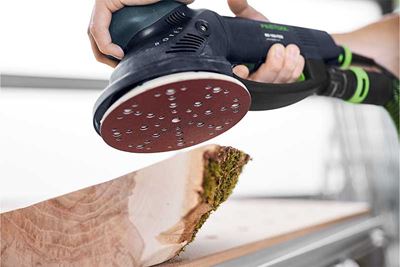 A piece of wood is sanded with a Rotex sander and matching Rubin abrasive